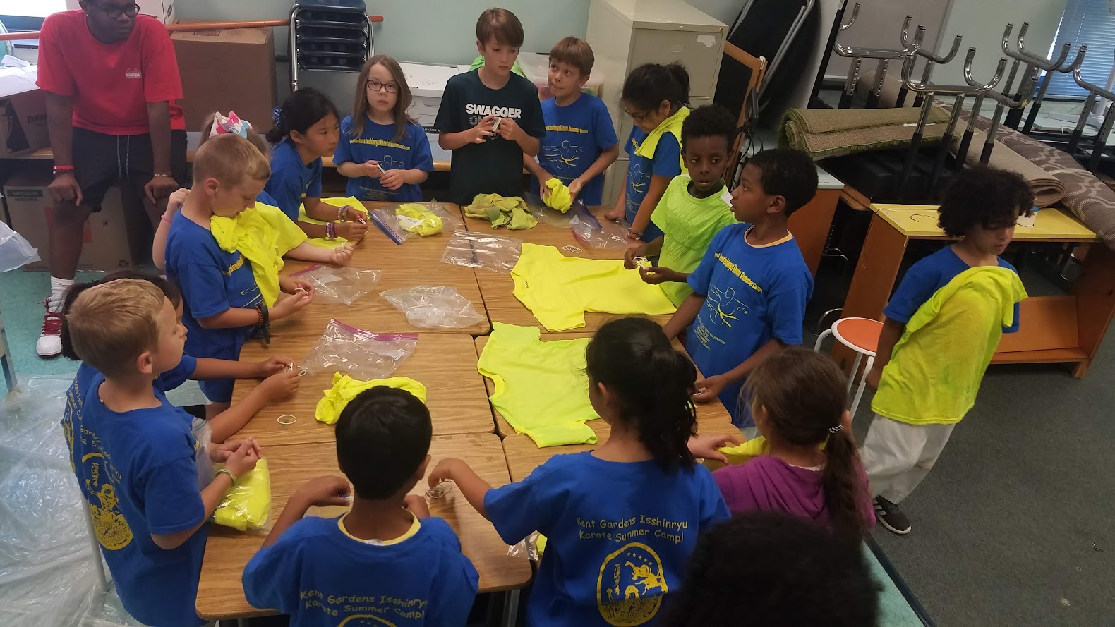 Kids working on tie-dye at table