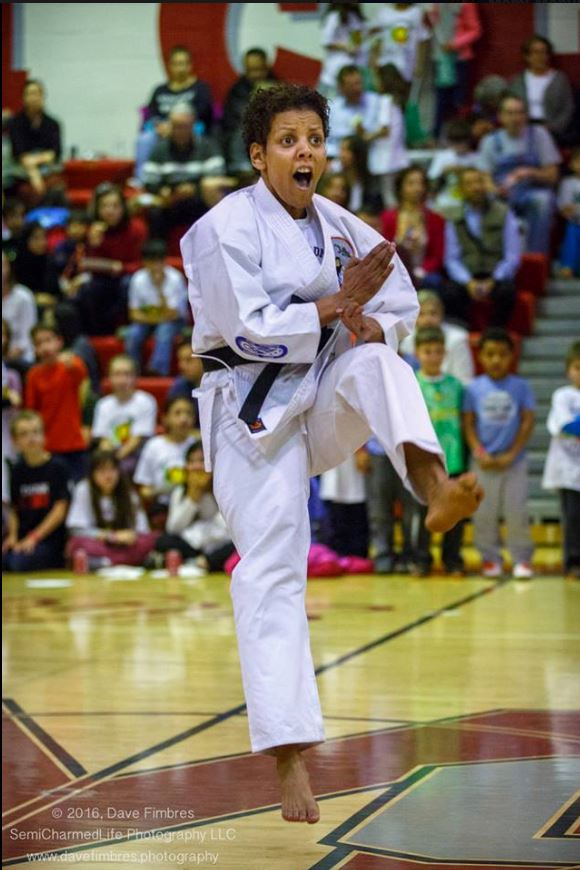 Sensei Mami performing a flying kick