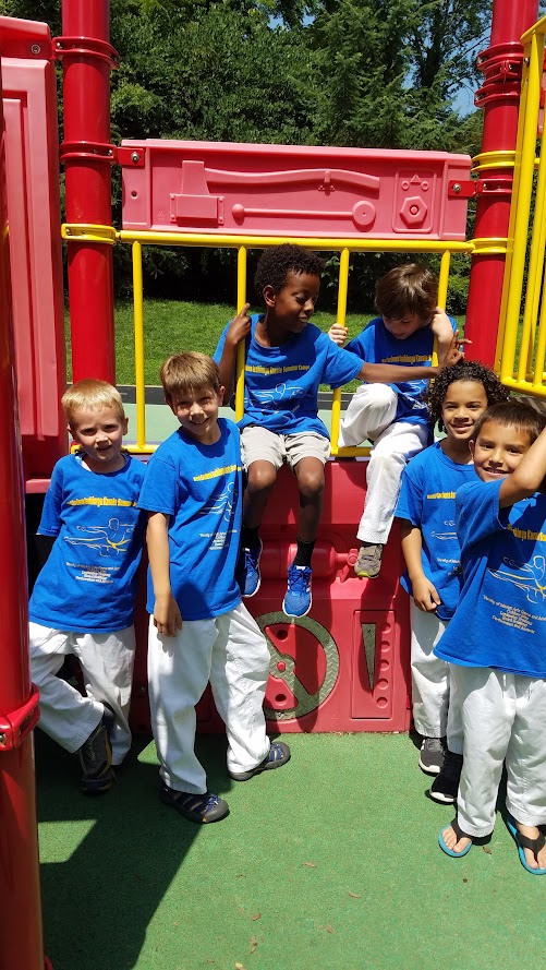 Group on red playground structure