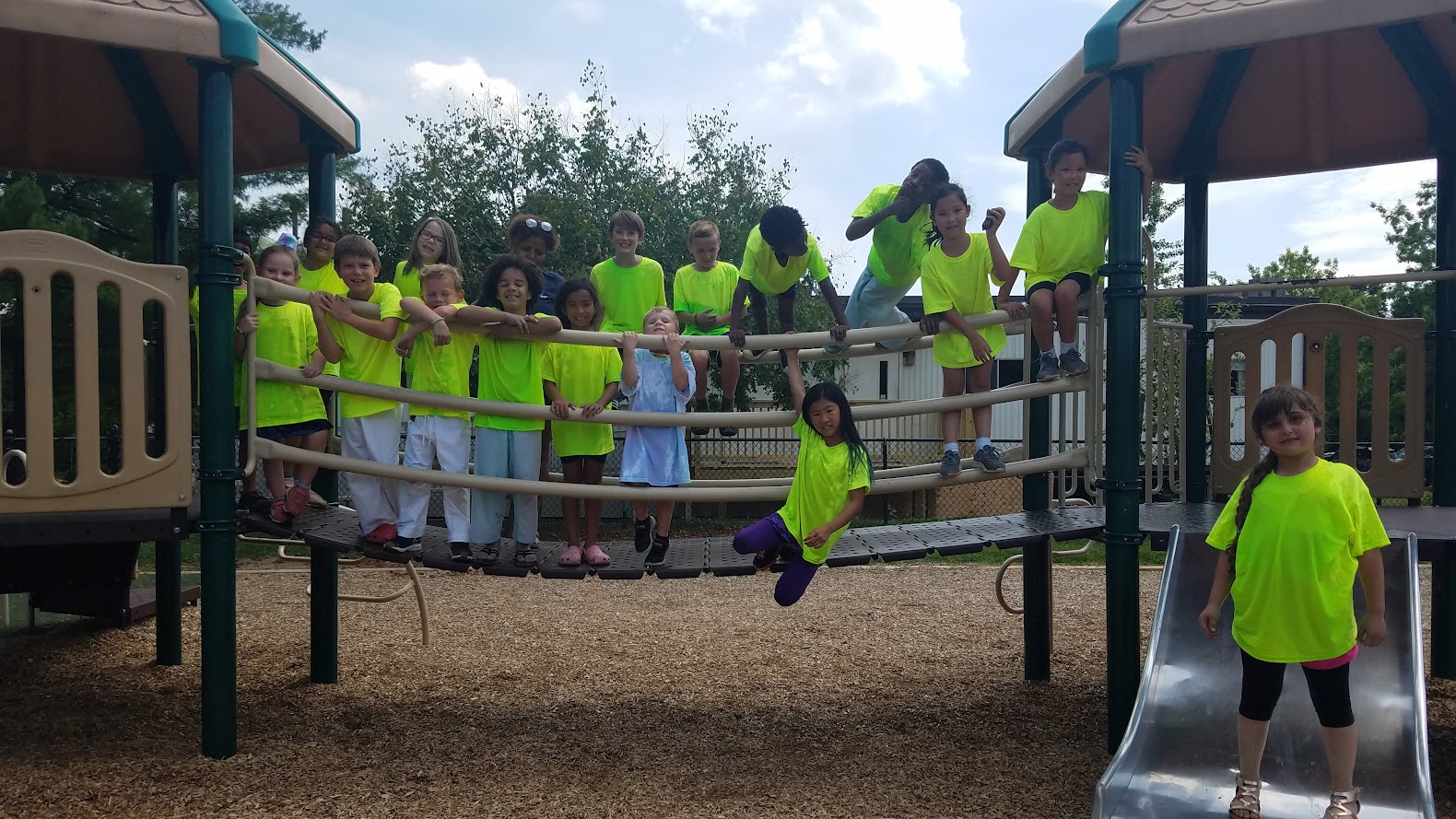 Kids posing on playground structure