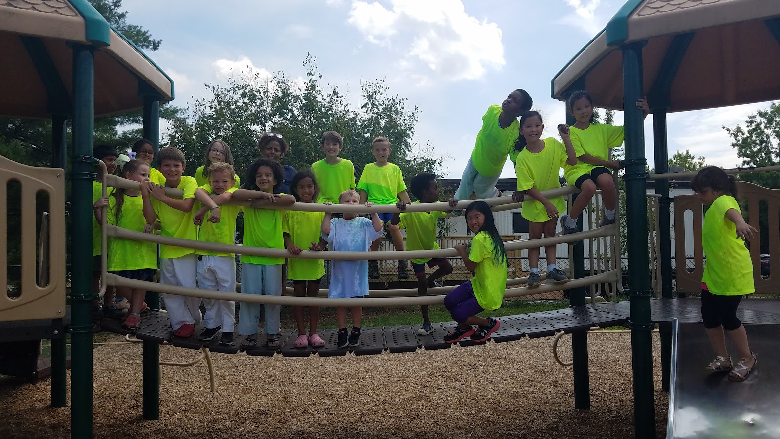 Happy campers on playground bridge