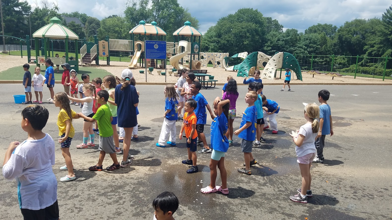 Large group water play at playground