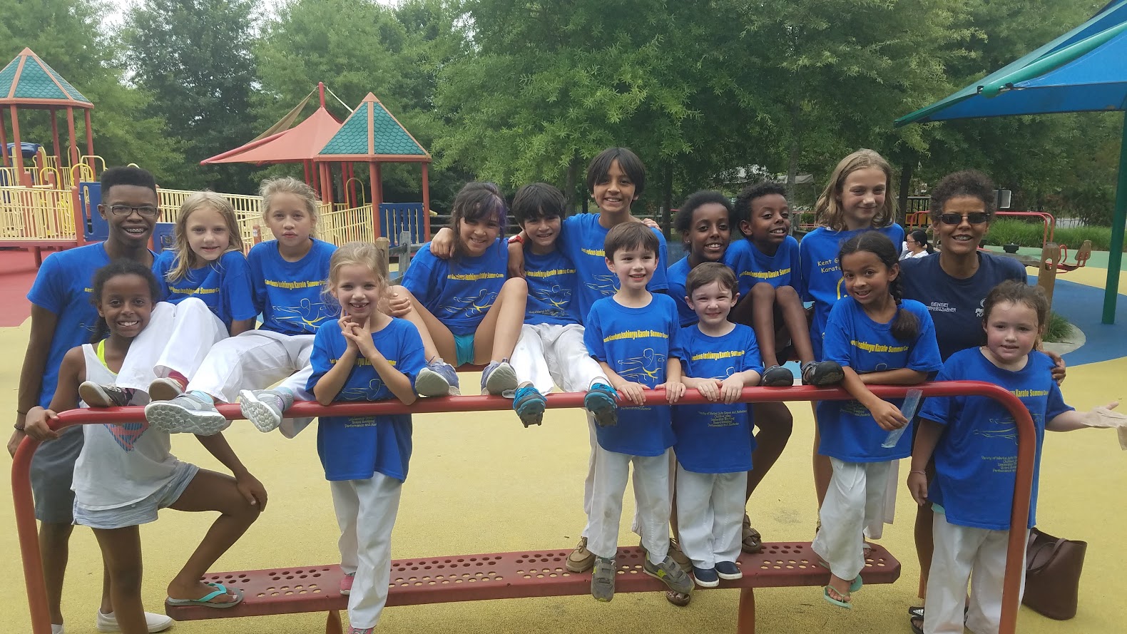 Kids at Kent Gardens Karate Summer Camp group photo at playground